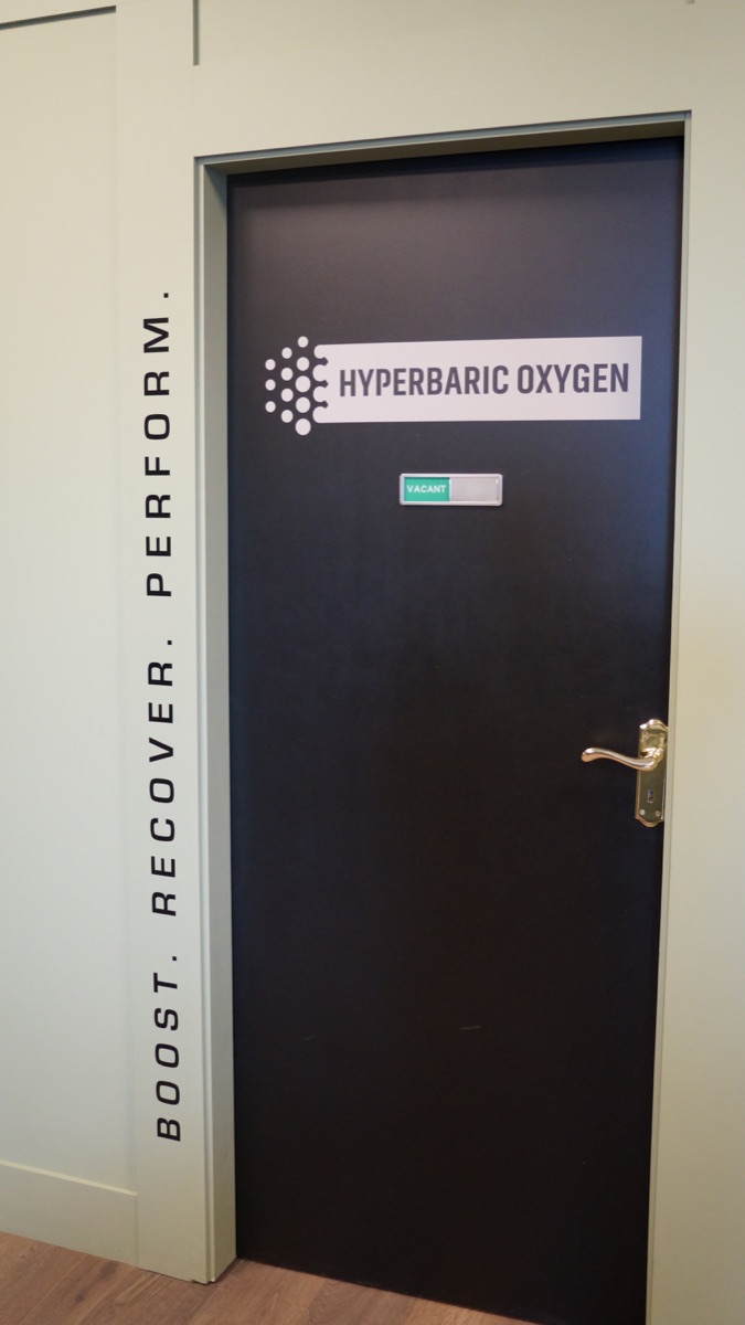 The hyperbaric oxygen room door, with its vacant tag